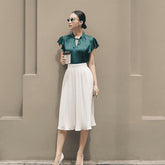 Silk pleated midi skirt with high-waisted fit for a flowy and elegant daytime silhouette